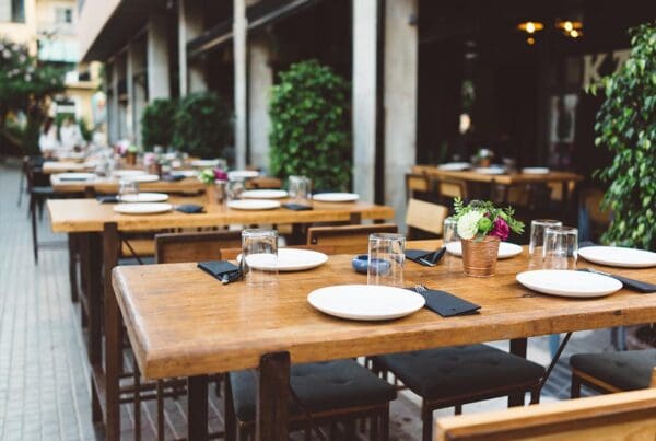Insurance by Industry - Outdoor Restaurant Seating with Wooden Tables During Happy Hour